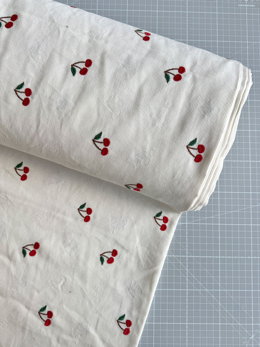Cherry embroidered needlecord - per half metre