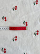 Cherry embroidered needlecord - per half metre
