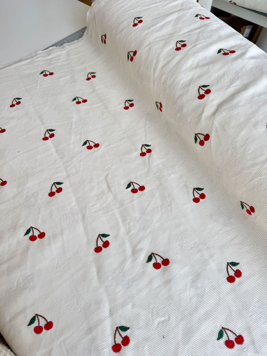 Cherry embroidered needlecord - per half metre